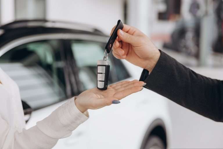 An exchange of car key in the automotive handover process. For RTS Academy.