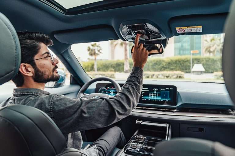 A man in a car as if he were a prospective customer. For the "Test Drives" RTS Academy course.
