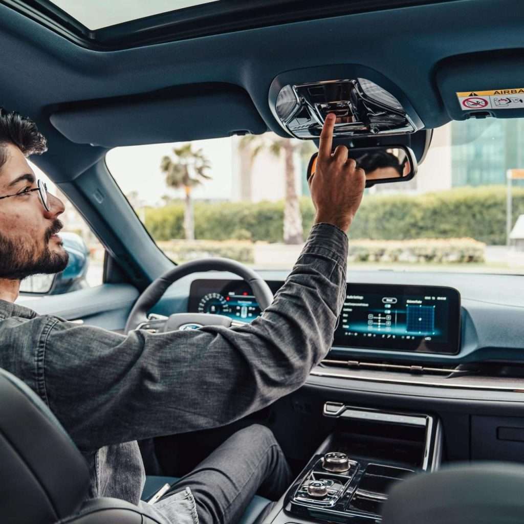A man in a car as if he were a prospective customer. For the "Test Drives" RTS Academy course.