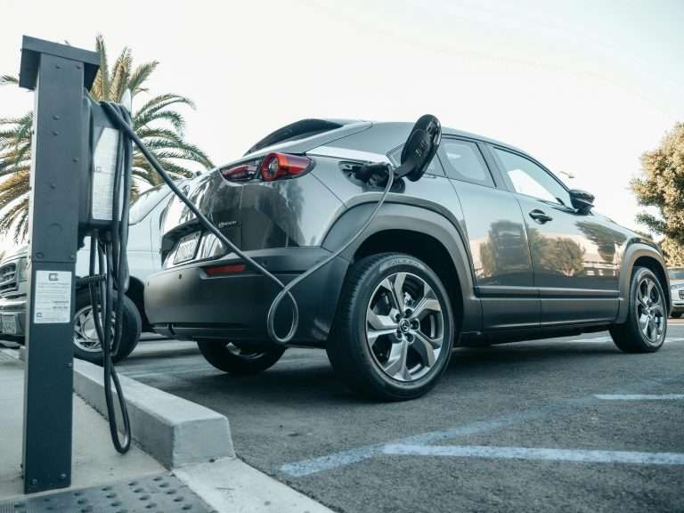 An electric vehicle plugged in and charging. For the leadership for EV course on RTS Academy.