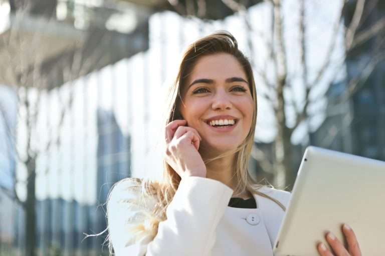 A lady with a tablet. Represents a finance manager at an automotive dealership. For RTS Academy.