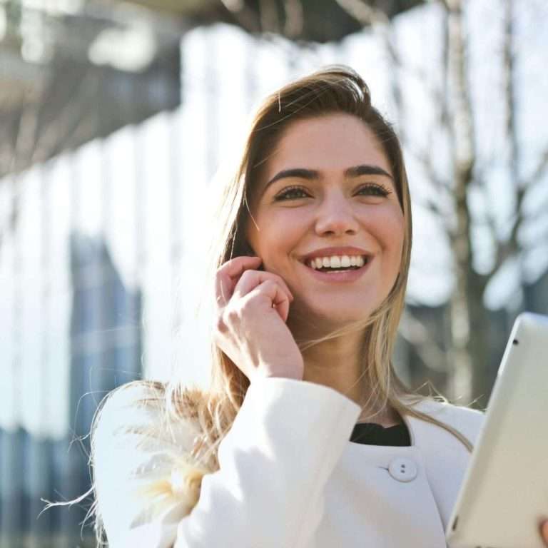 A lady with a tablet. Represents a finance manager at an automotive dealership. For RTS Academy.